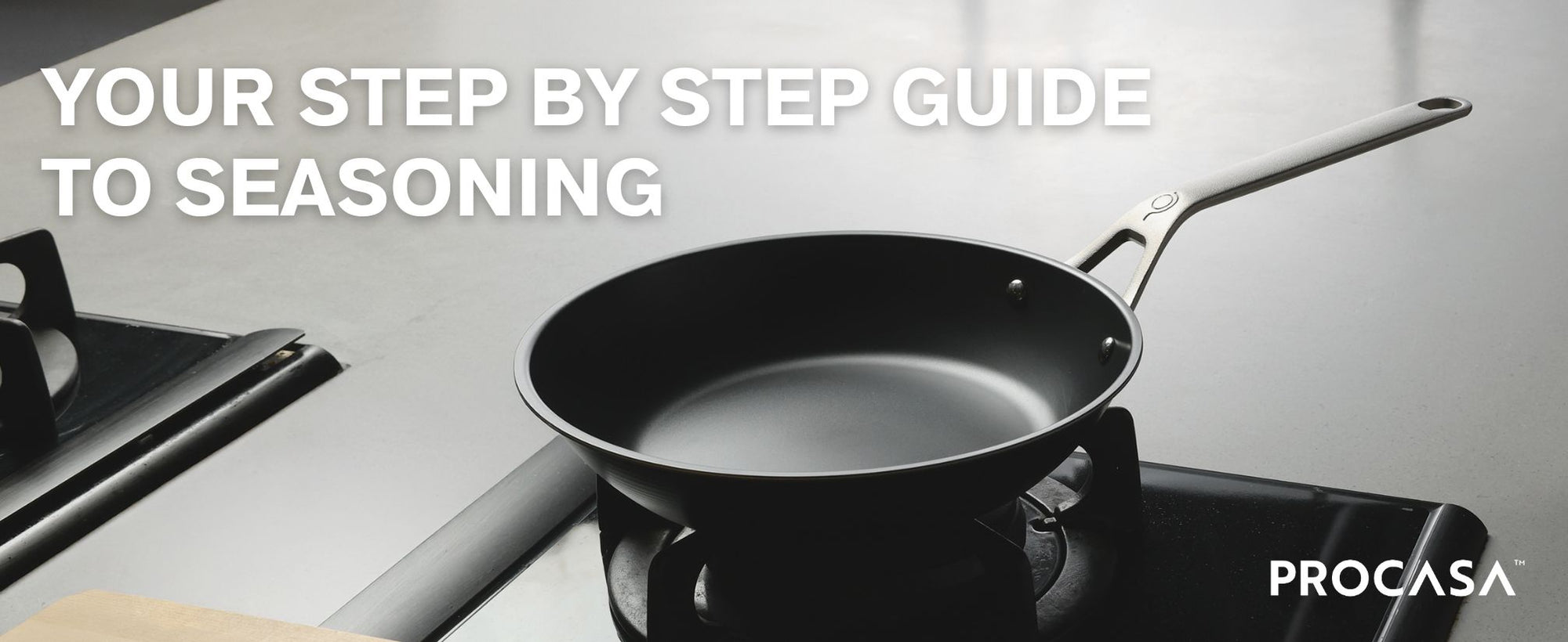 Black PROCASA Tri-ply carbon steel clad frying pan on a stove with text 'Your step by step guide to seasoning' and 'PROCASA' branding.